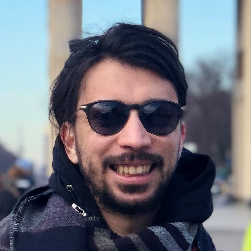 Sinan Aksay smiling with cool shades